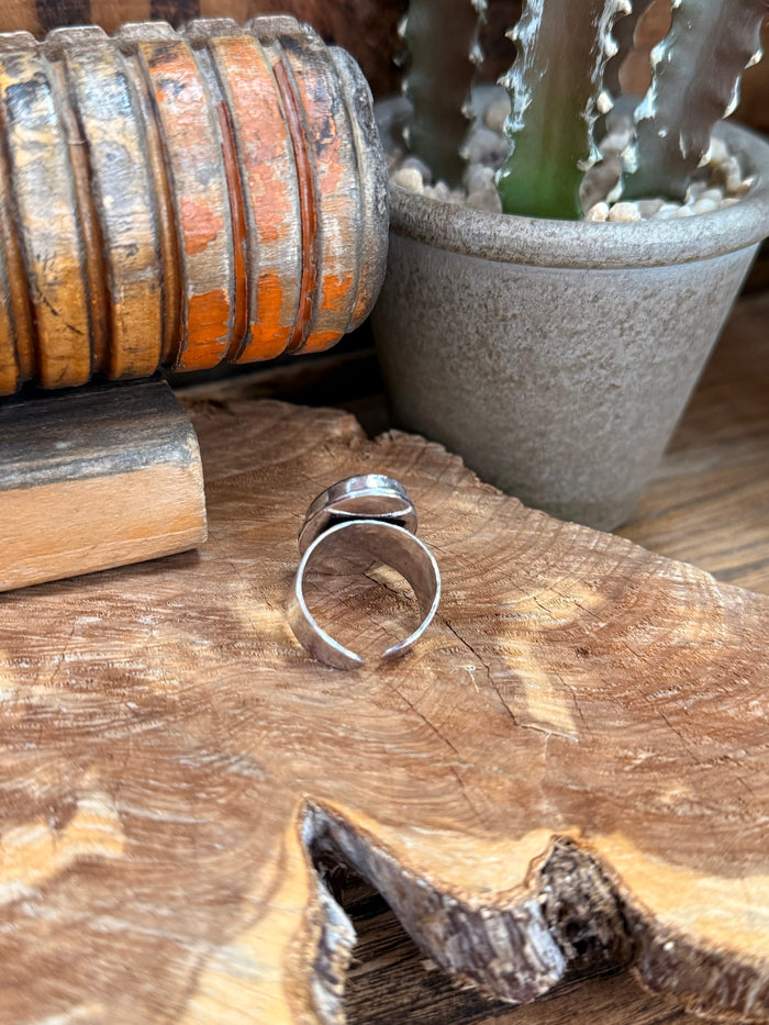 Open adjustable silver-plated band ring with oval labradorite stone, side view