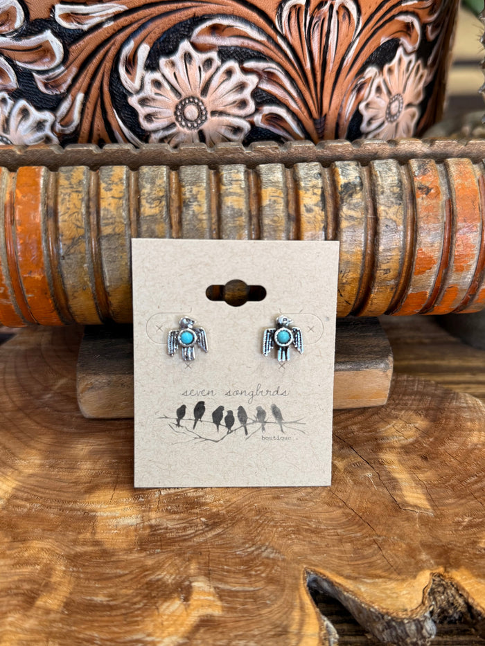 Silver thunderbird stud earrings with turquoise oval cabochon, small wing details