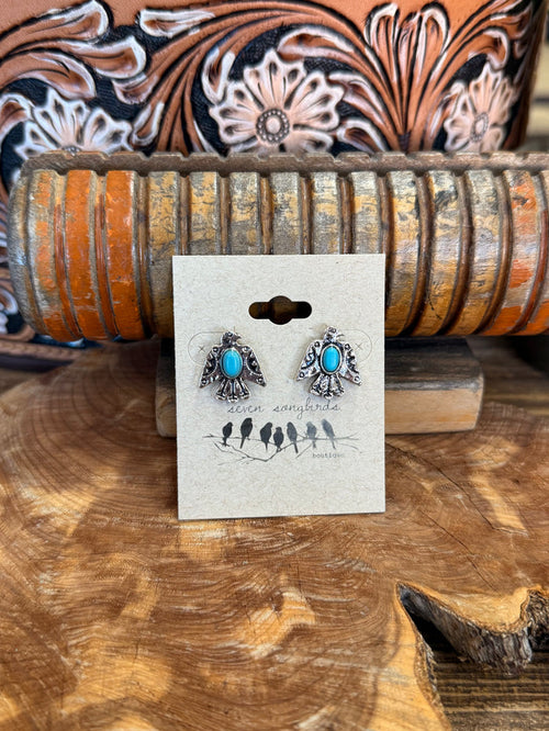 Thunderbird stud earrings with turquoise teardrop stones and silver-tone detailing