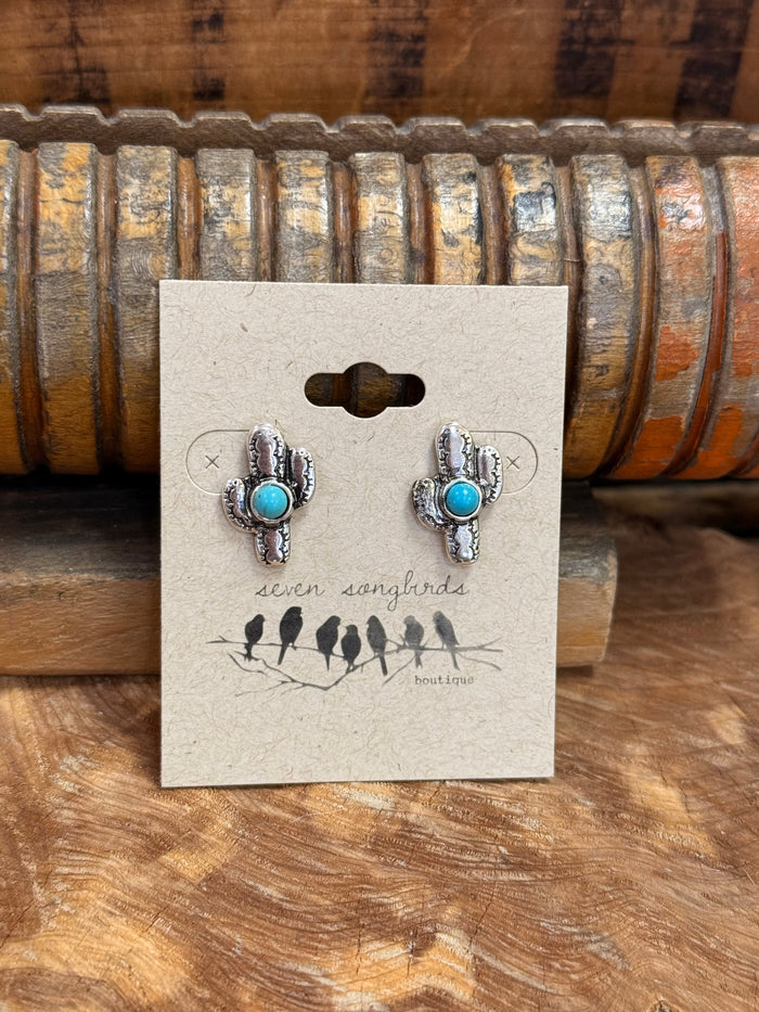 Silver-tone turquoise stud earrings with oval stones and arched silver settings