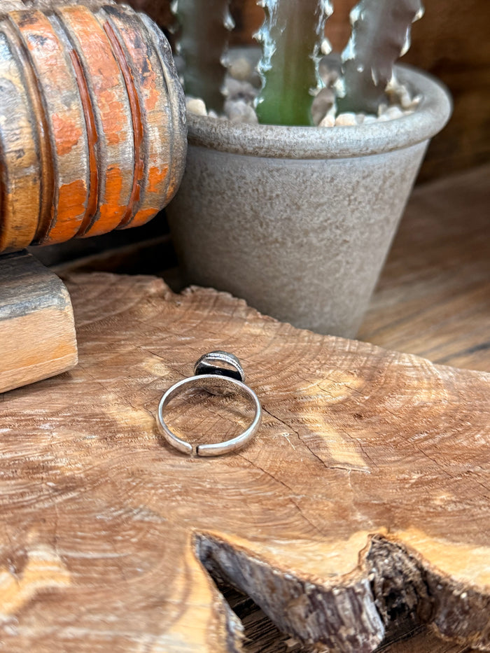 Adjustable silver-toned ring with open back band