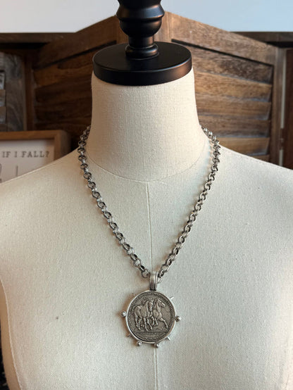 Silver-tone curb chain necklace featuring a round horse medallion pendant