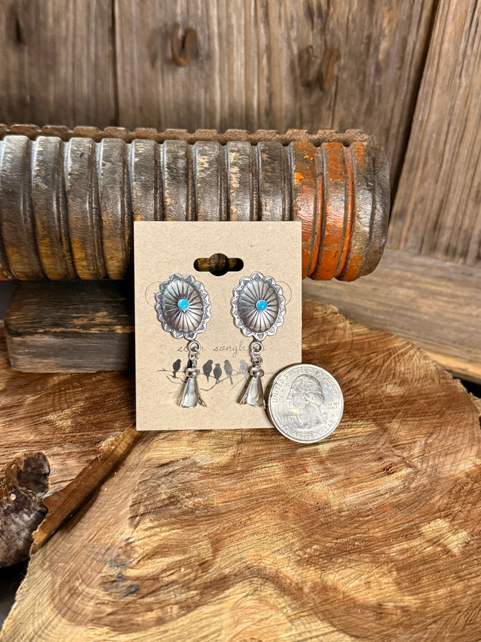 Turquoise concho stud earrings with silver scalloped discs and bell charms, coin shown for size