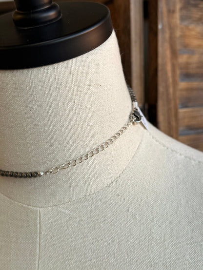 Silver-tone chain necklace with turquoise rectangle pendant and link detail