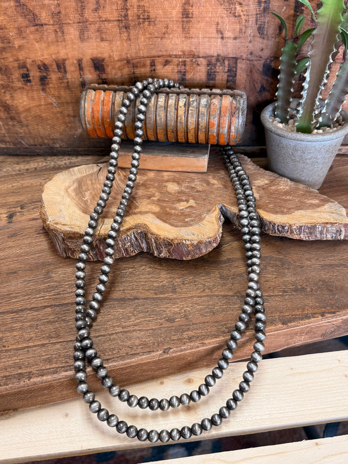 Endless long bead pearl necklace, dark gray round beads in layered loops