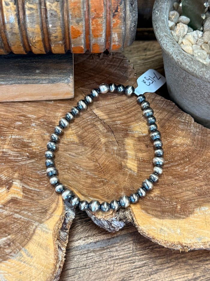 Silver pearl beaded stretchy bracelet, close view of round bead details