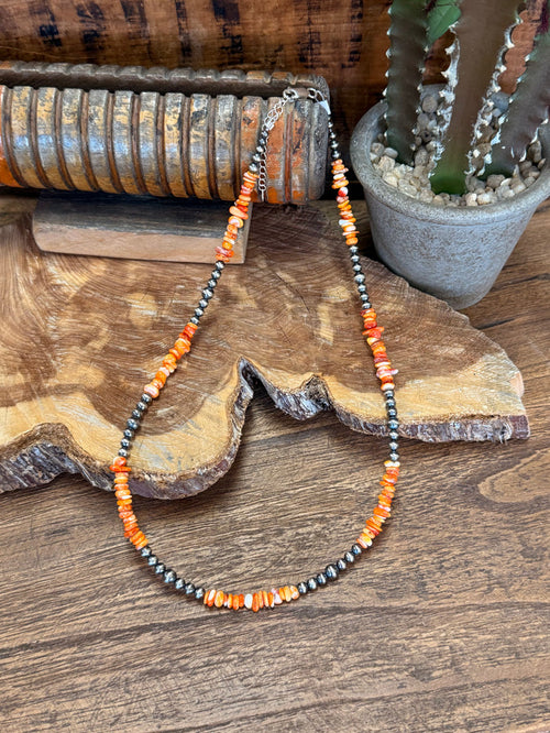 Orange spiny oyster chip necklace with silver-tone beads, beaded strand