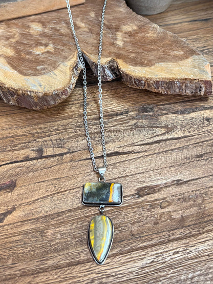 Silver-plated lariat necklace showing layered rectangular and teardrop bee jasper pendants