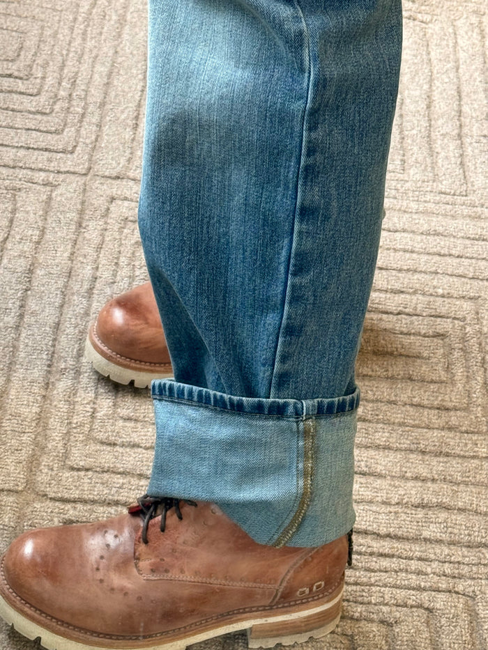 Mid-wash blue jeans with folded cuff hem and light-wash contrast band.