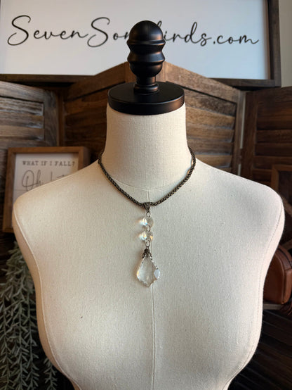Silver-tone chain necklace with crystal teardrop pendant and two small drop charms