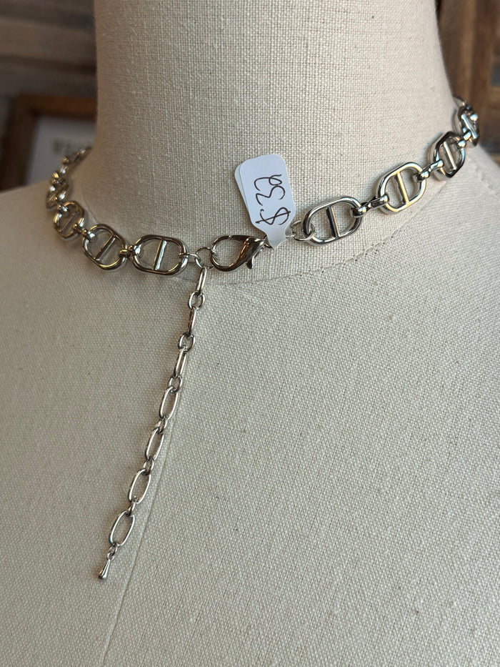 Silver bottle-cap link necklace with hanging chain and small charm tag