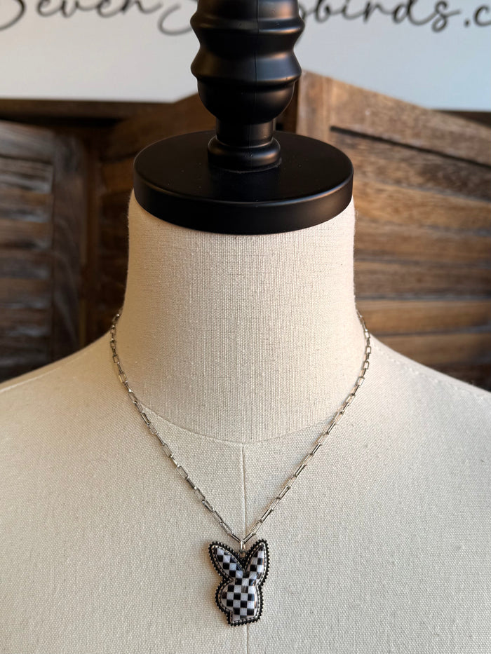 Silver chain necklace with checkered bunny pendant, black and white detailing