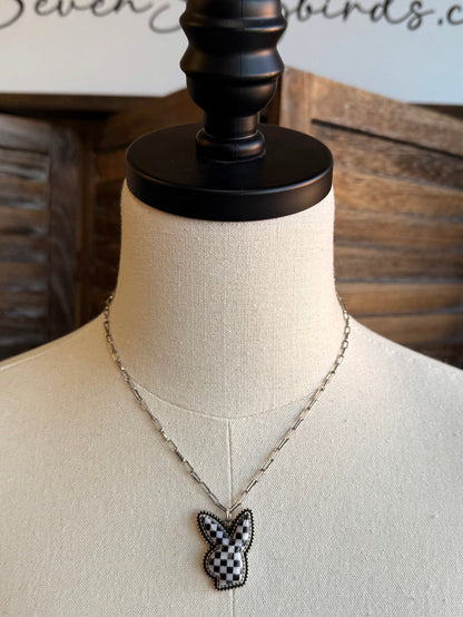 Silver chain necklace with checkered bunny pendant, black and white detailing