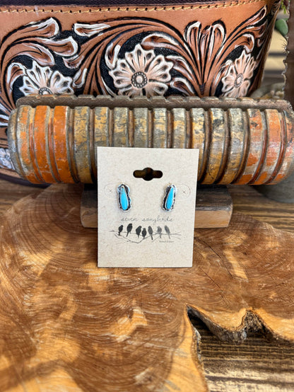 Silver and turquoise teardrop stud earrings with blue oval stones on metal posts.