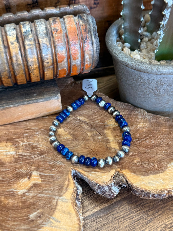 Dark blue and silver stretchy bracelet with silver spacer beads, round bead pattern