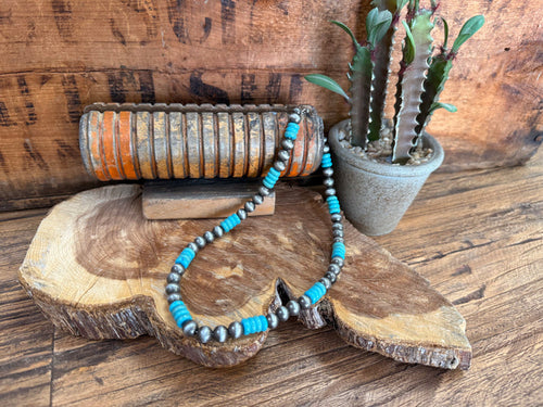 Turquoise and silver pearl bead necklace with silver accents and horn-like pendant
