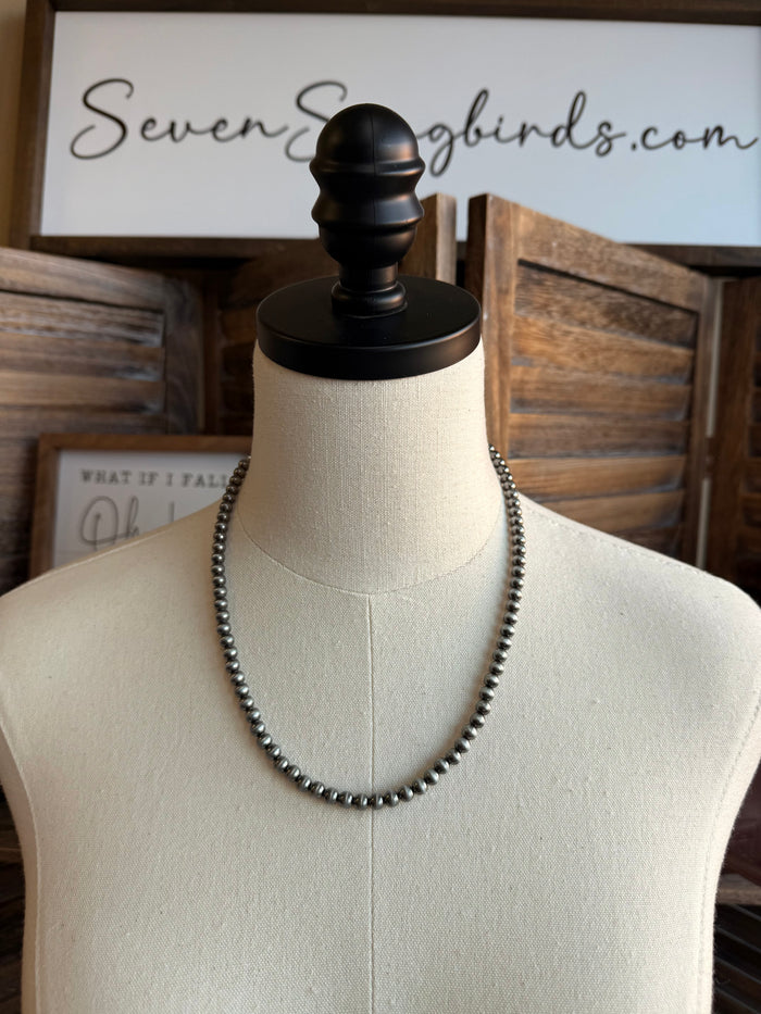 18-inch 6mm silver-tone beaded necklace on a mannequin with a single strand
