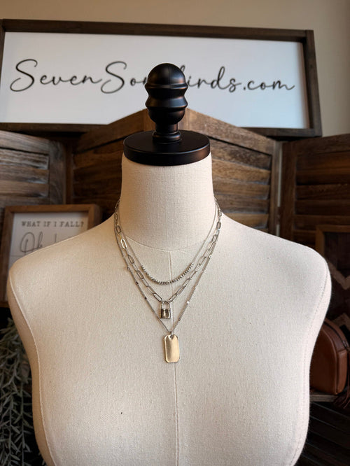Triple-layer silver lock charm necklace, three chains with lock and plate pendants