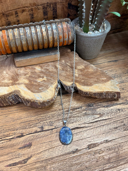 Silver-plated necklace with oval blue sodalite pendant on a slender chain