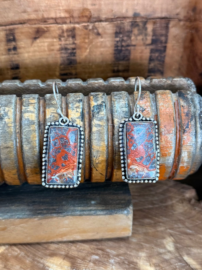 Rectangular lace agate earrings with silver fishhook and ornate border, red-orange patterned stone