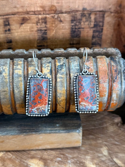 Rectangular lace agate earrings with silver fishhook and ornate border, red-orange patterned stone