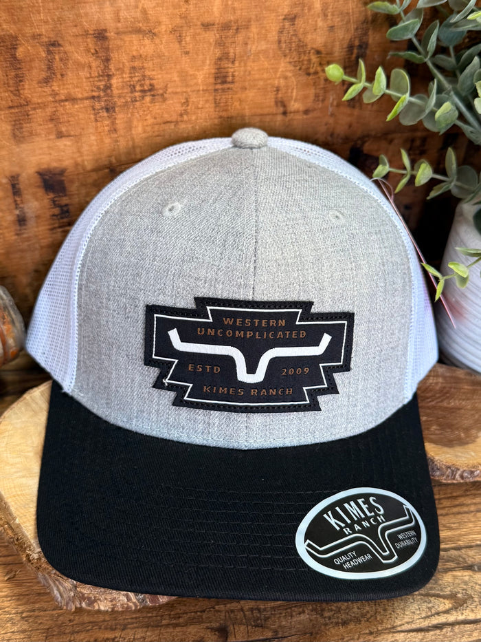Grey heather cap with black brim and Western Uncomplicated front logo patch