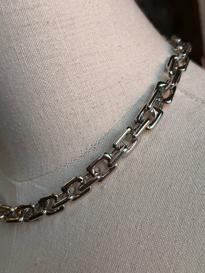 Close-up of chunky silver chain links necklace