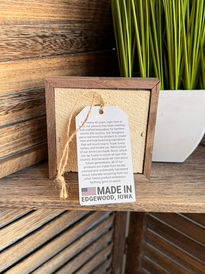 Framed 4x4 wall art back with hanging hook and "Made in Edgewood, Iowa" label