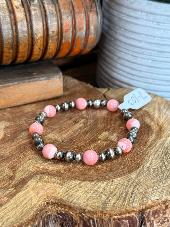 Stretchy pink and silver-tone beaded bracelet with pearl-like accents