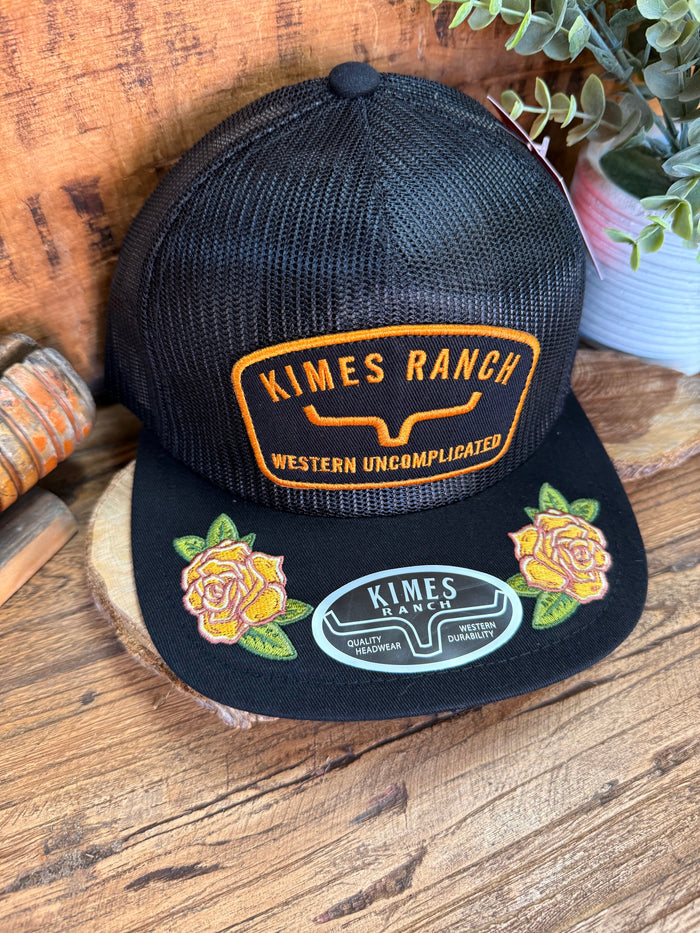 Black mesh baseball cap with Kimes Ranch patch and embroidered rose side details