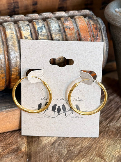 Gold-tone textured hoop earrings with hook backs, displayed on white product card