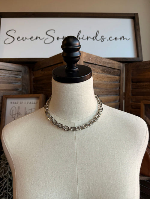 Chunky silver chain necklace on mannequin display