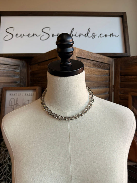 Chunky silver chain necklace on mannequin display