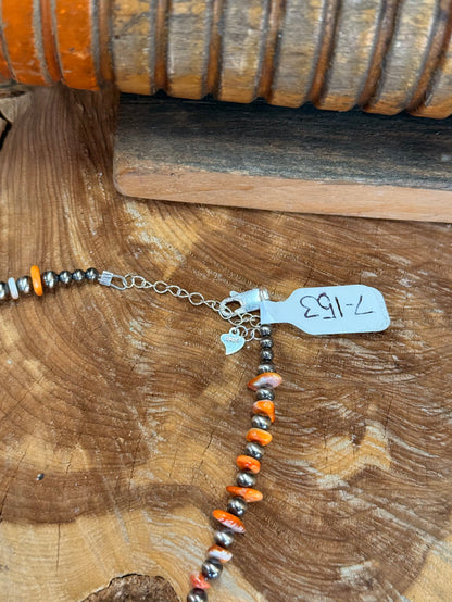 Orange spiny oyster chip necklace with sterling silver clasp and short extender chain