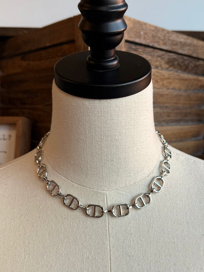 Silver bottle-cap link chain necklace, close view on mannequin