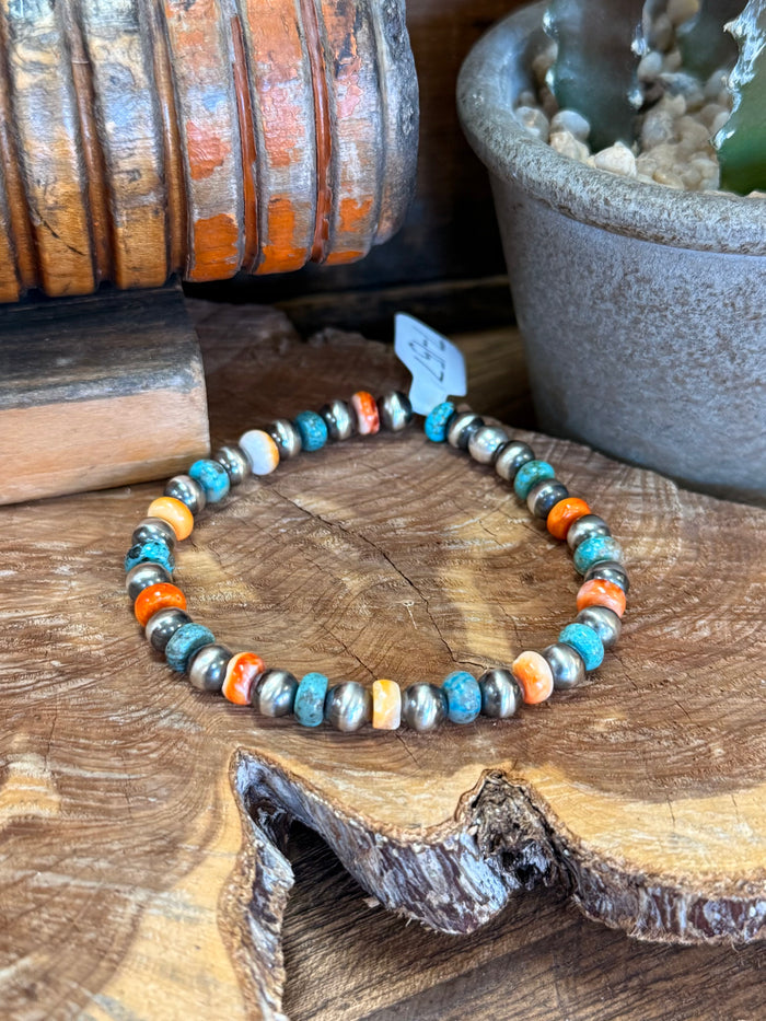 Turquoise beaded bracelet with orange spiny oyster segments and white shell pearls
