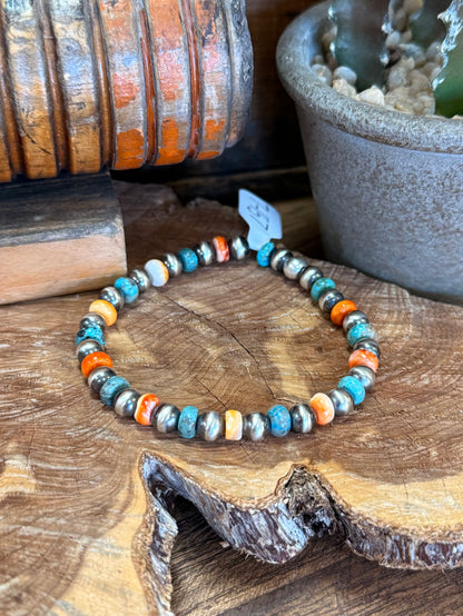 Turquoise beaded bracelet with orange spiny oyster segments and white shell pearls