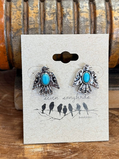 Turquoise teardrop thunderbird stud earrings with silver-tone openwork border