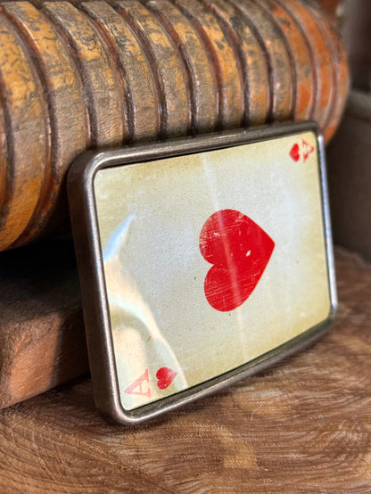 Ace of hearts belt buckle angled view with red heart and small corner icons