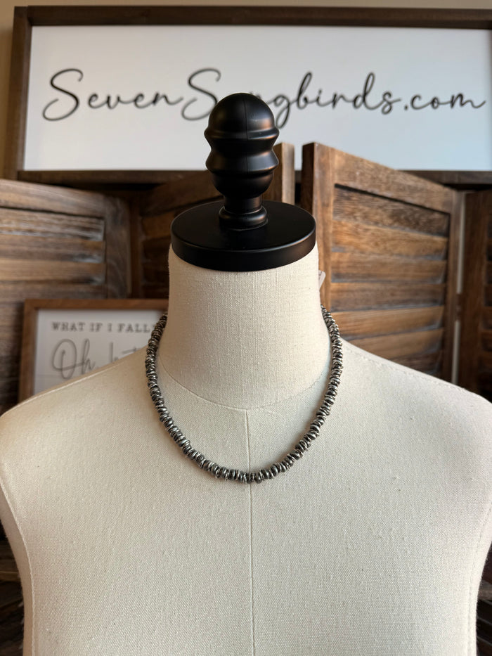 Silver pearl mixed bead necklace with double-row beaded choker on mannequin bust