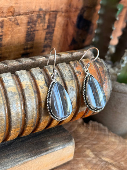 Blue opal teardrop fishhook earrings, silver setting and textured edge detail