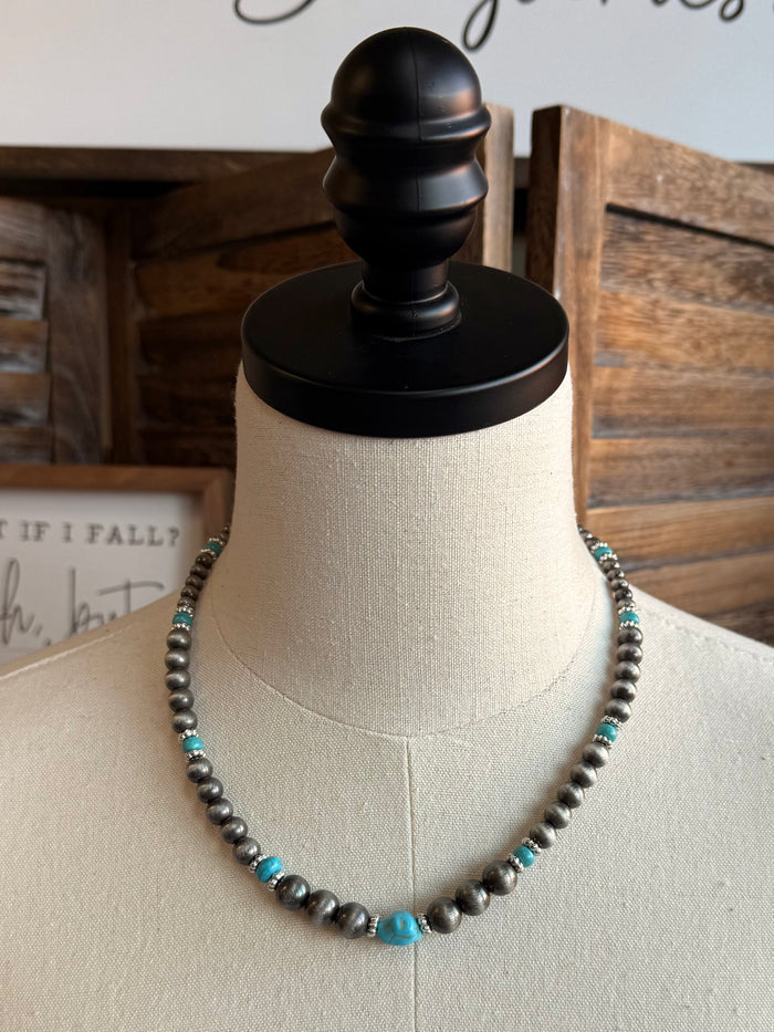 Beaded necklace with silver-toned pearl beads and small turquoise bead accents