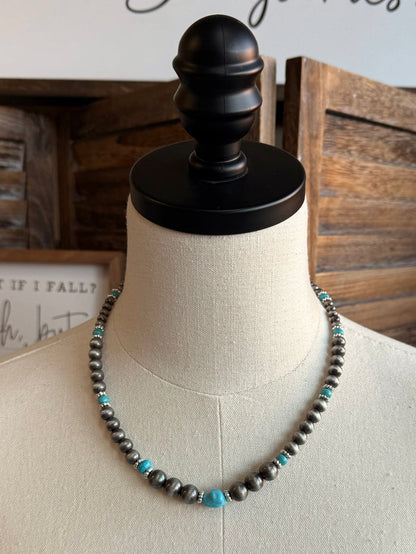 Beaded necklace with silver-toned pearl beads and small turquoise bead accents