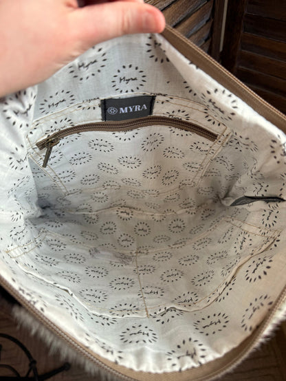 Leather purse interior with patterned lining and Myra logo label