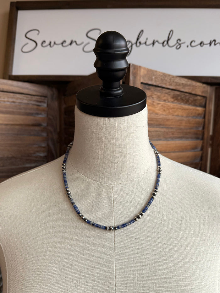 Blue sodalite heishi necklace with silver beads on mannequin display