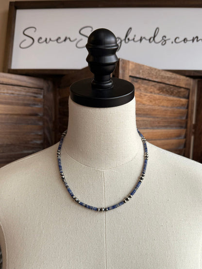 Blue sodalite heishi necklace with silver beads on mannequin display