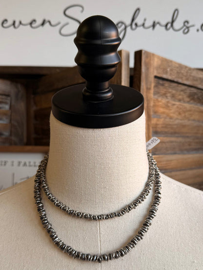 Silver pearl bead necklace with two stacked beaded rows on a mannequin bust