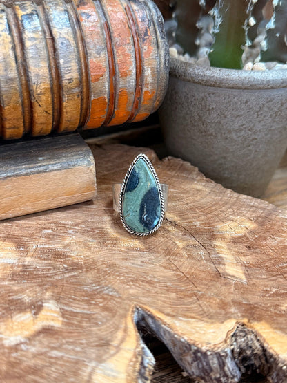 Teardrop gemstone adjustable ring with silver-toned bezel and blue-green stone face