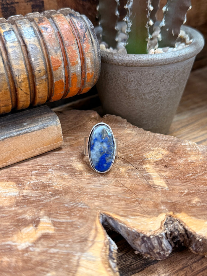 Silver-plated adjustable ring with oval blue lapis stone bezel