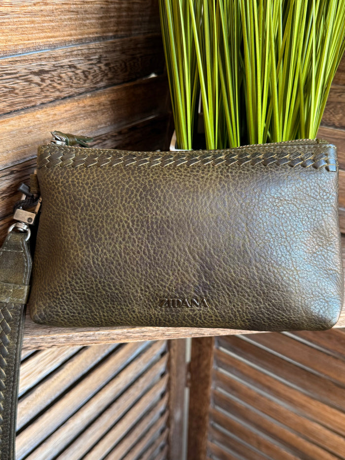 Olive mini wristlet bag with textured finish and metal zipper, wrist strap visible